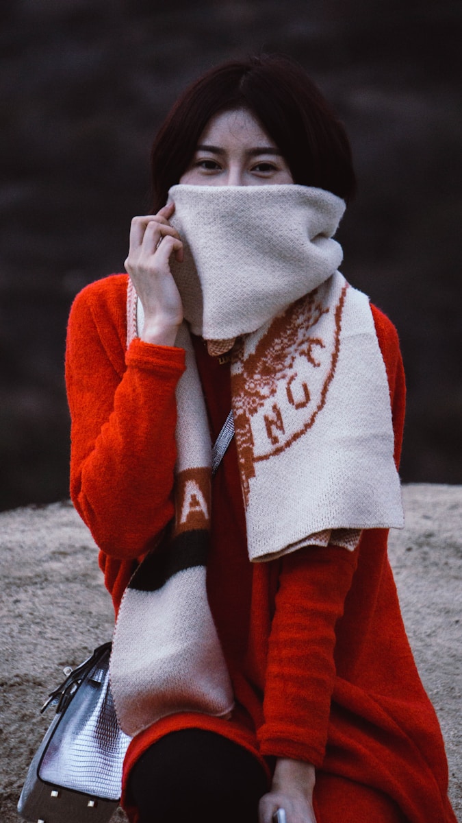 person in red and white hoodie
