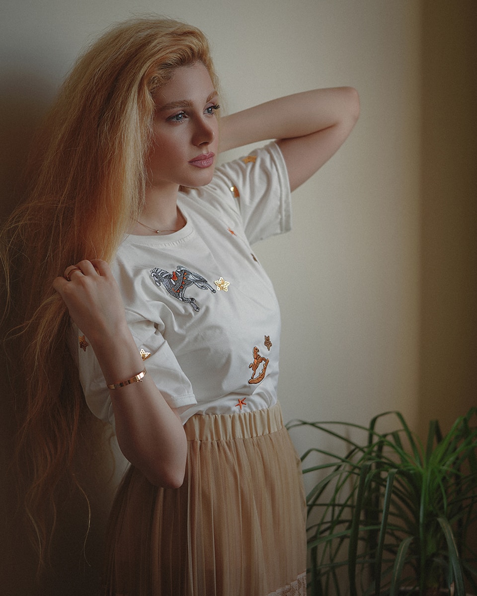 girl in white crew neck t-shirt and white skirt